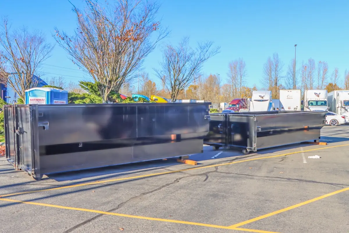 Professional dumpster rental service with roll-off container on residential driveway in Shady Hills